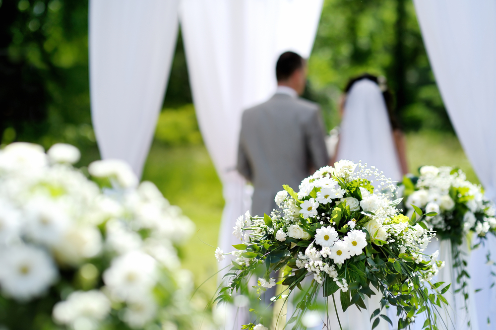 outdoor wedding ceremony and couple standing at the altar