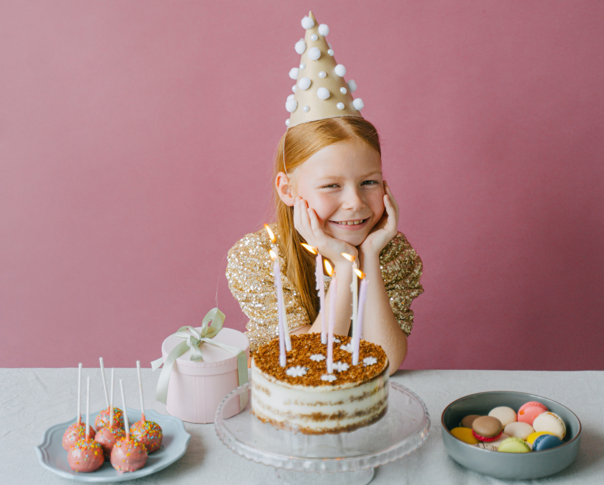 happy girl in gold dress celebrating her birthday