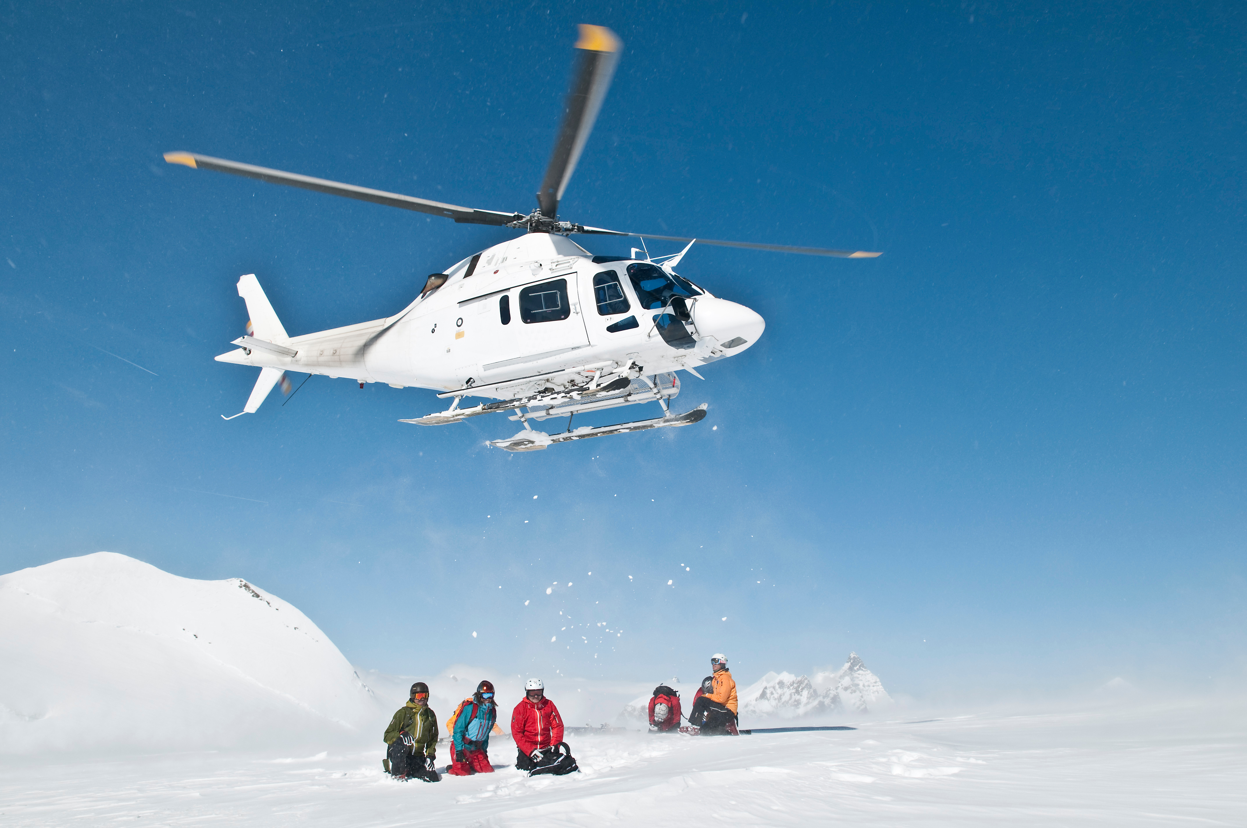 A group of people heli-skiing