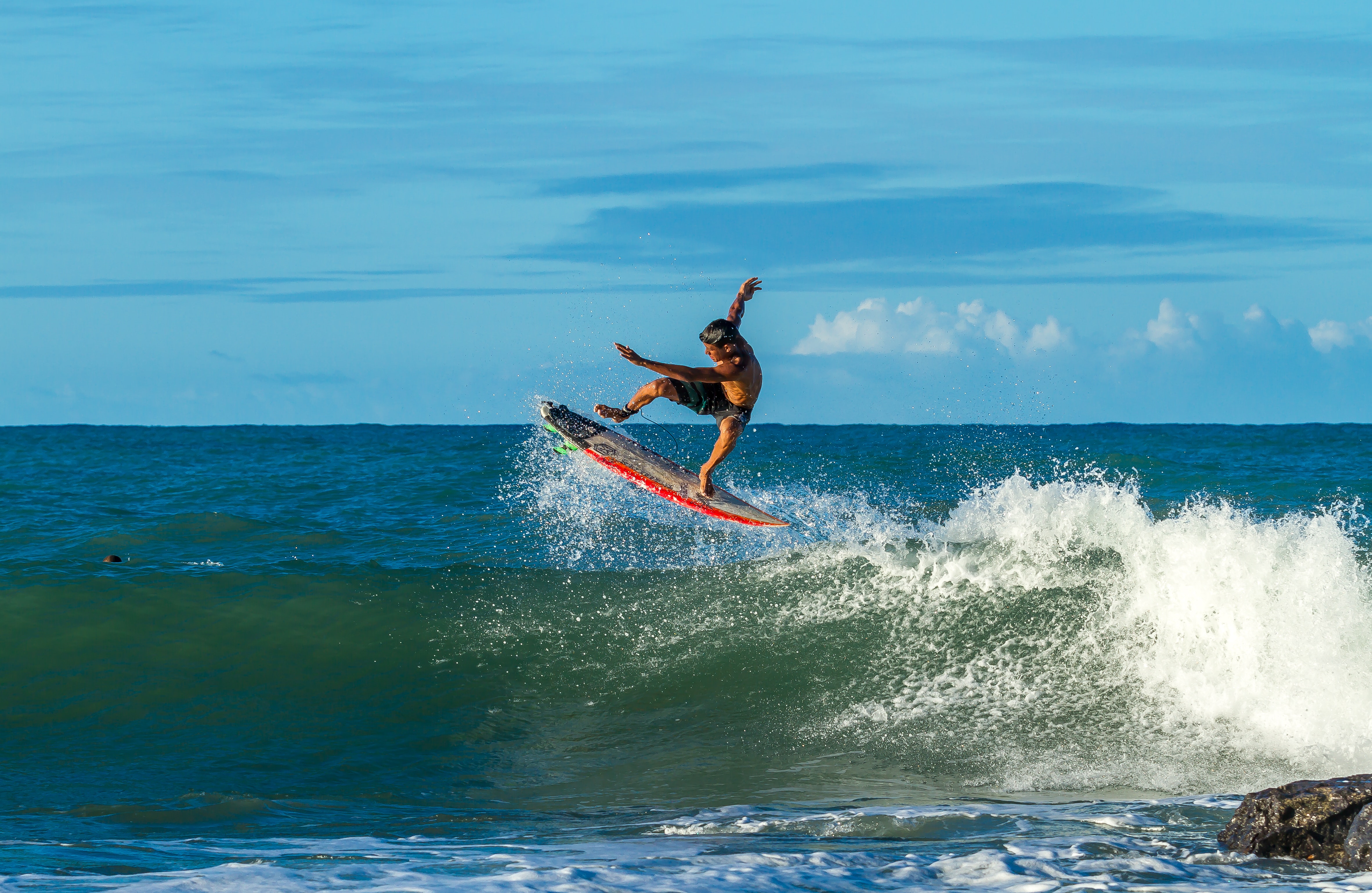 A man surfing in the ocean