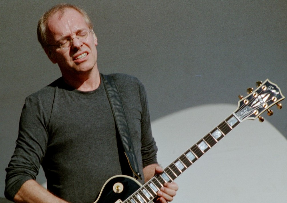 Peter Frampton playing a guitar