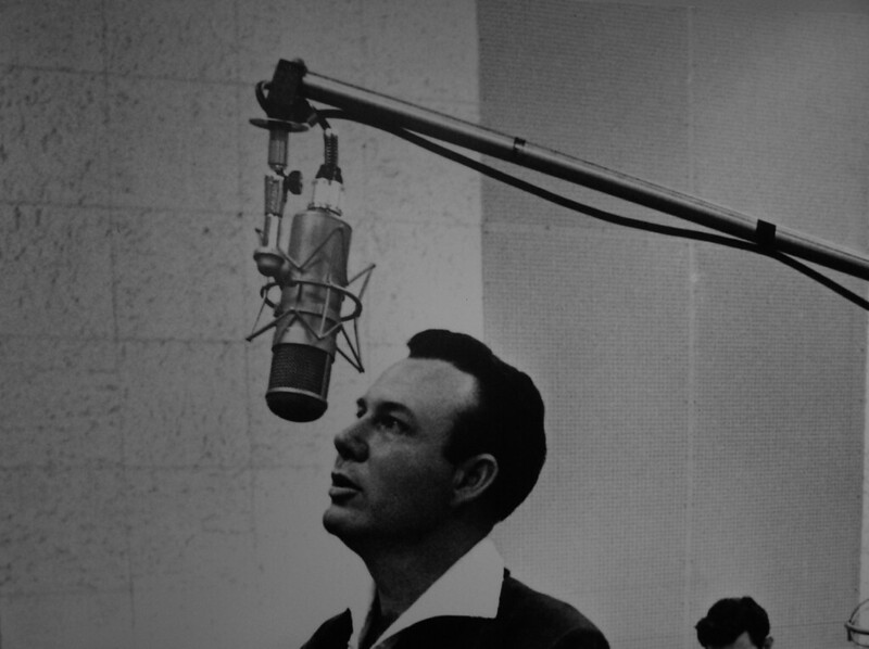 Jim Reeves in front of a microphone