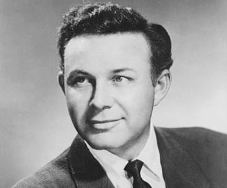 Jim Reeves wearing a black suit