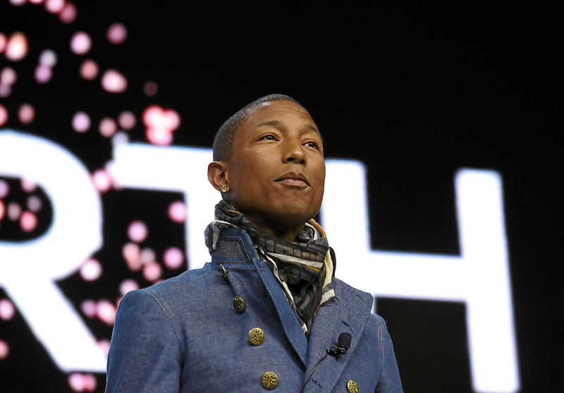 Pharrell Williams wearing a blue jacket