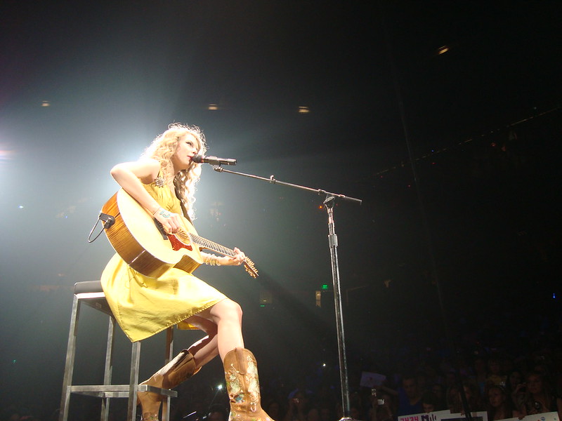 Taylor Swift wearing a yellow dress