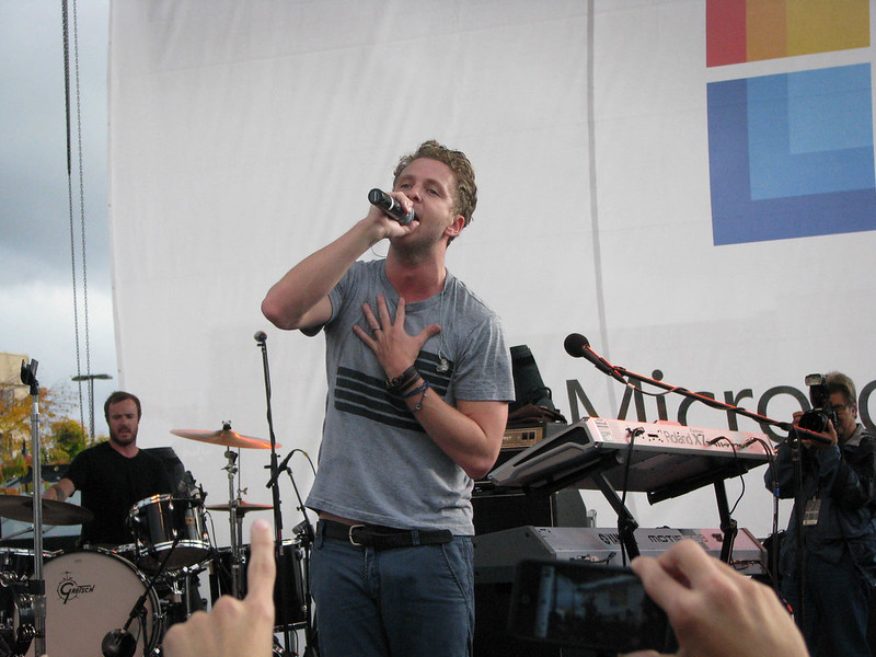 Ryan Tedder wearing a grey t-shirt