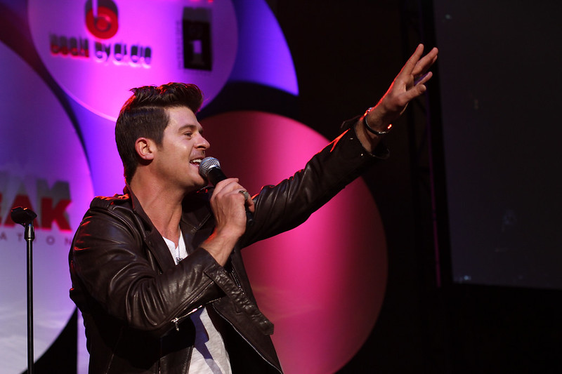 Robin Thicke wearing a brown jacket