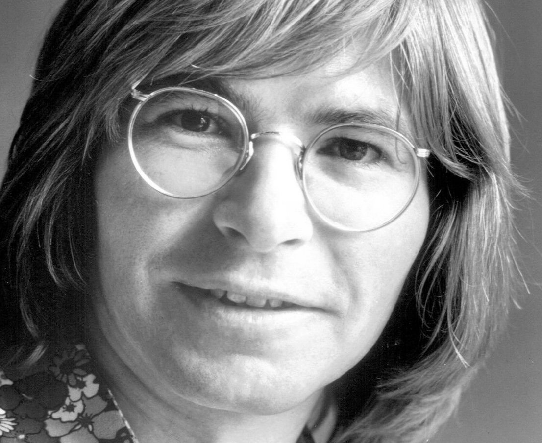 John Denver with a pair of glasses