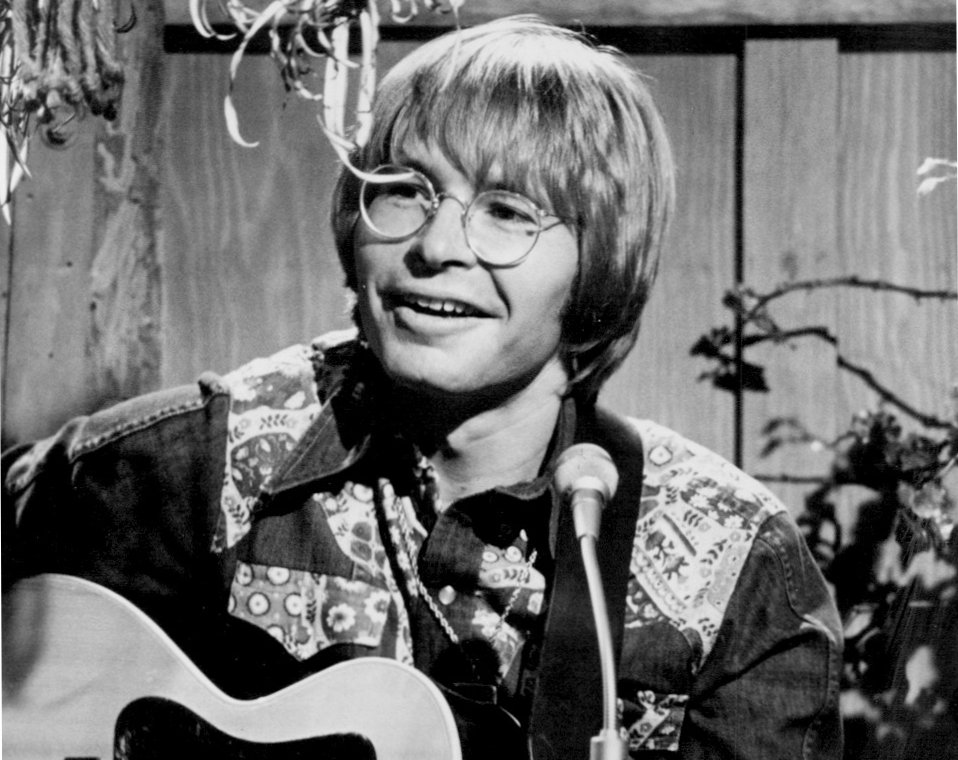 John Denver with a pair of glasses