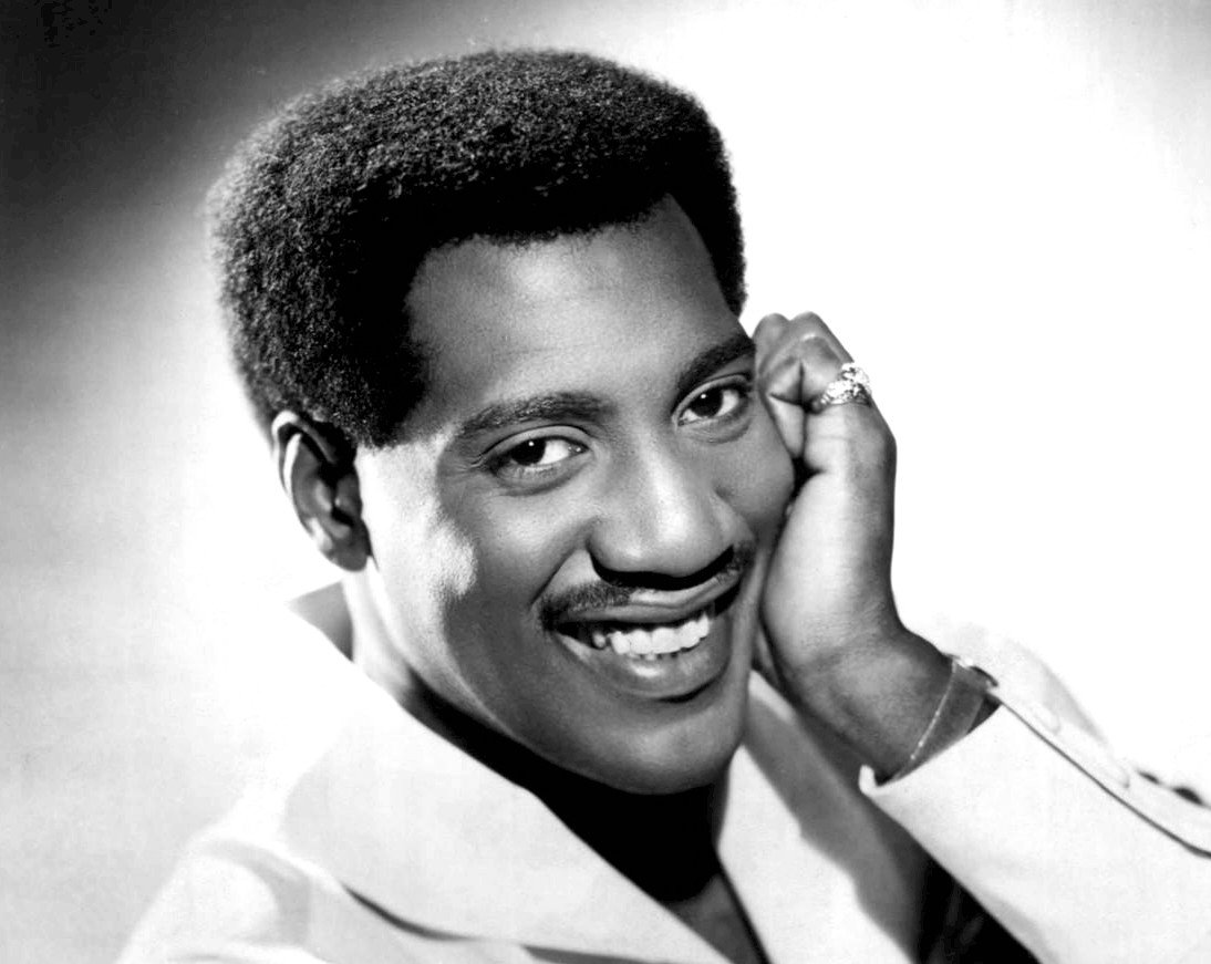 Otis Redding wearing a white shirt